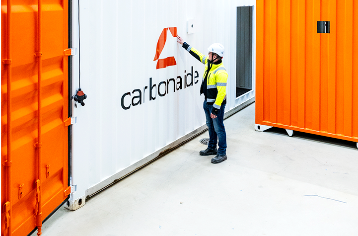 COO Jonne inspecting a new Carbonaide carbon dioxide curing system.